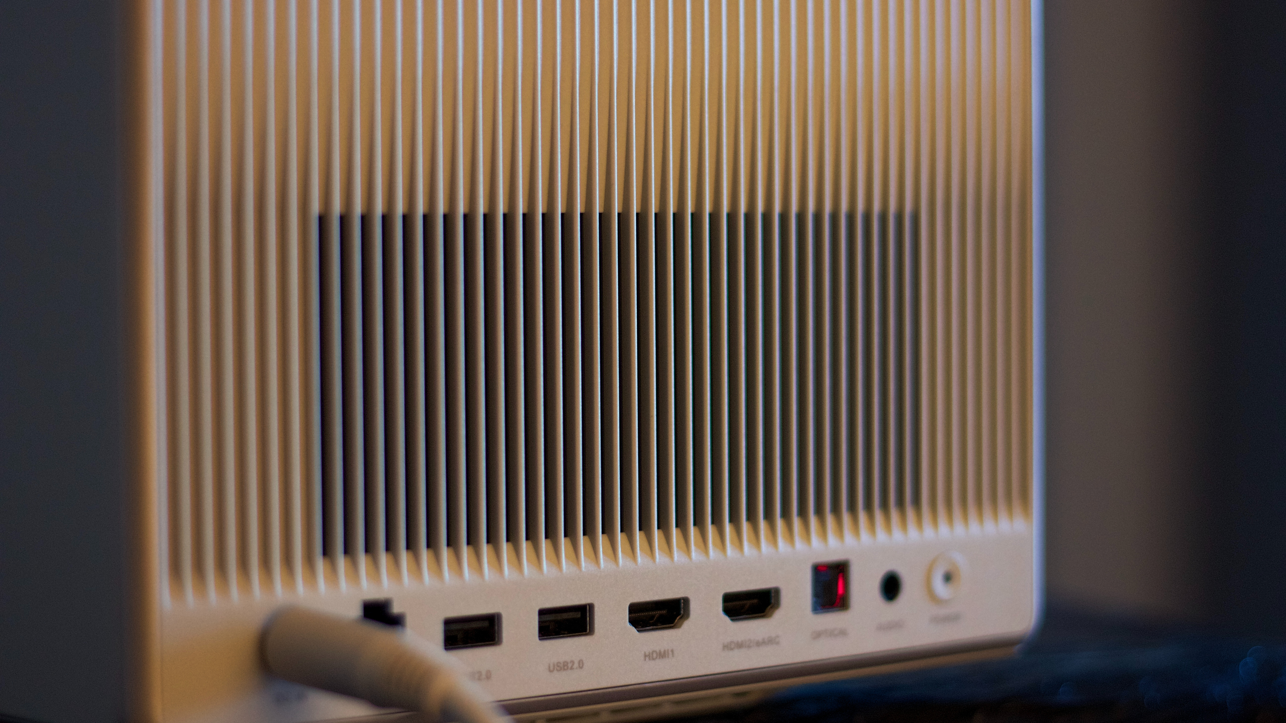 the back of a projector grille with various connectivity ports