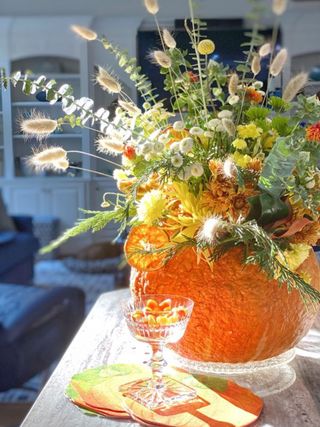 A floral arrangement inside a pumpkin
