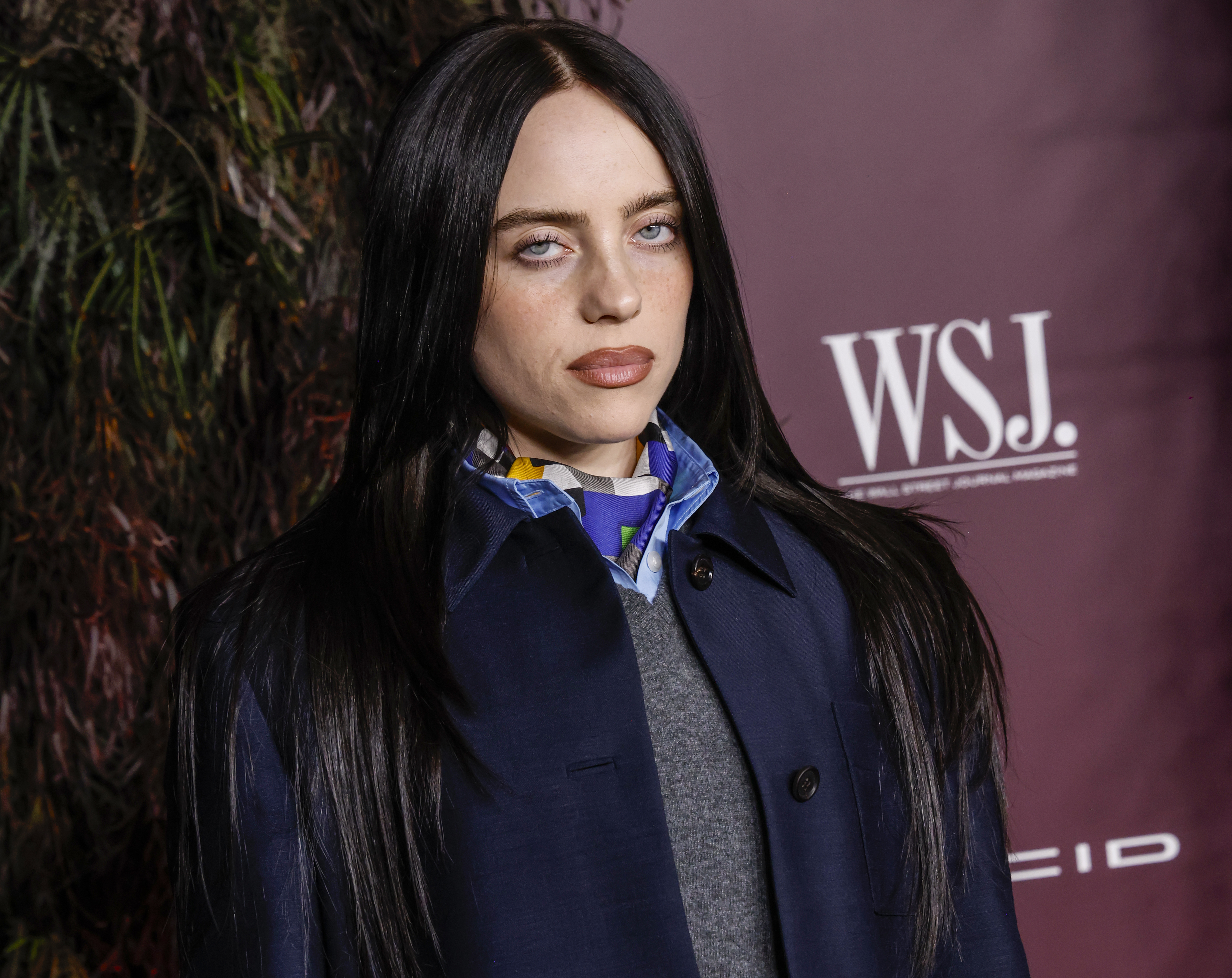 Billie Eilish wearing a middle part hairstyle
