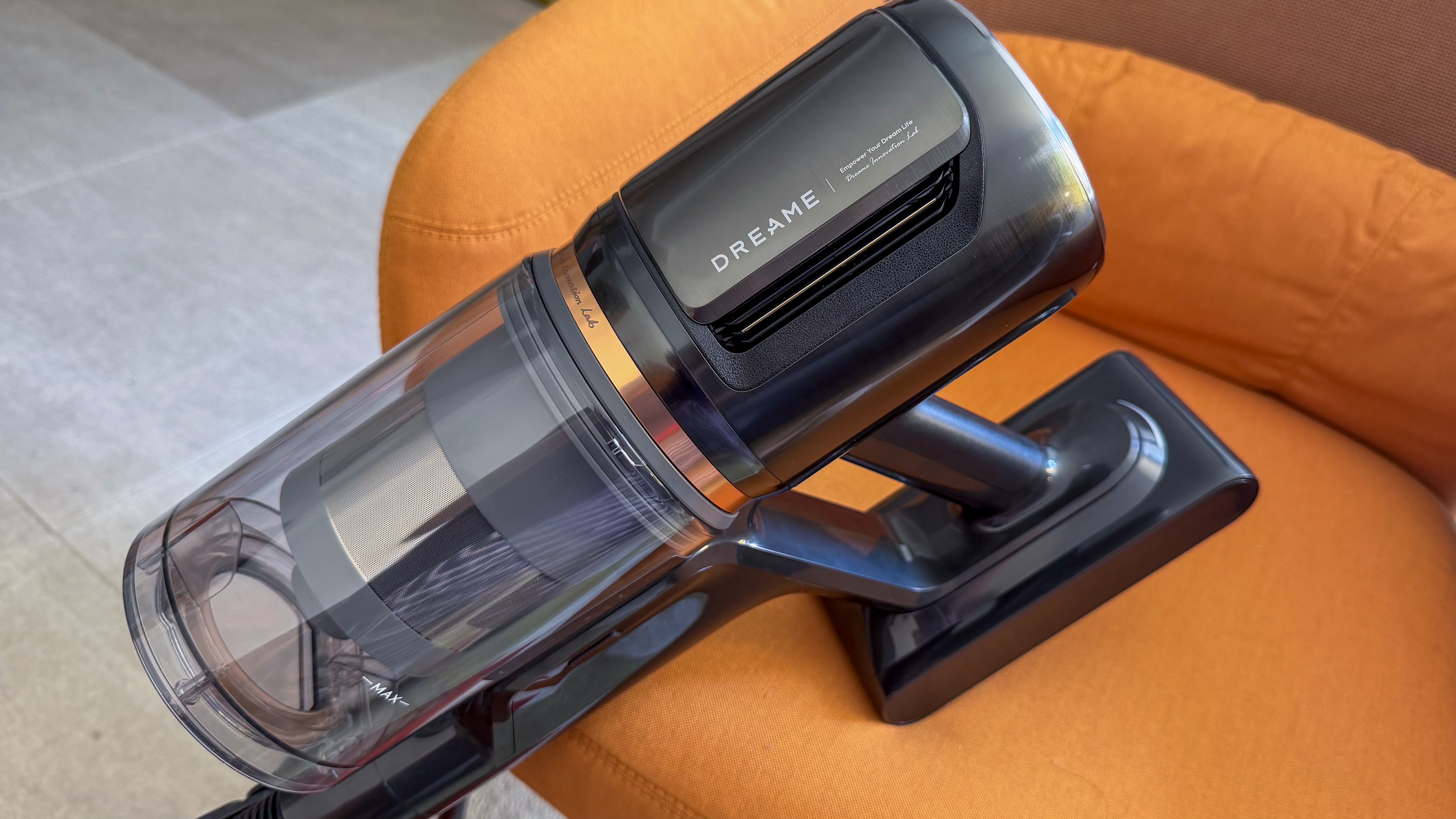 Dreame Z50 Station handheld unit on. a chair