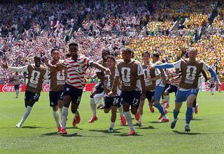 SEATTLE, WASHINGTON - JUNE 19: Alex Freeman #16 of the United States celebrates with teammates after scoring his team's second goal during the FIFA World Cup 2026 Group D match between USA and Australia at Seattle Stadium on June 19, 2026 in Seattle, Washington. (Photo by Jamie Squire/Getty Images)