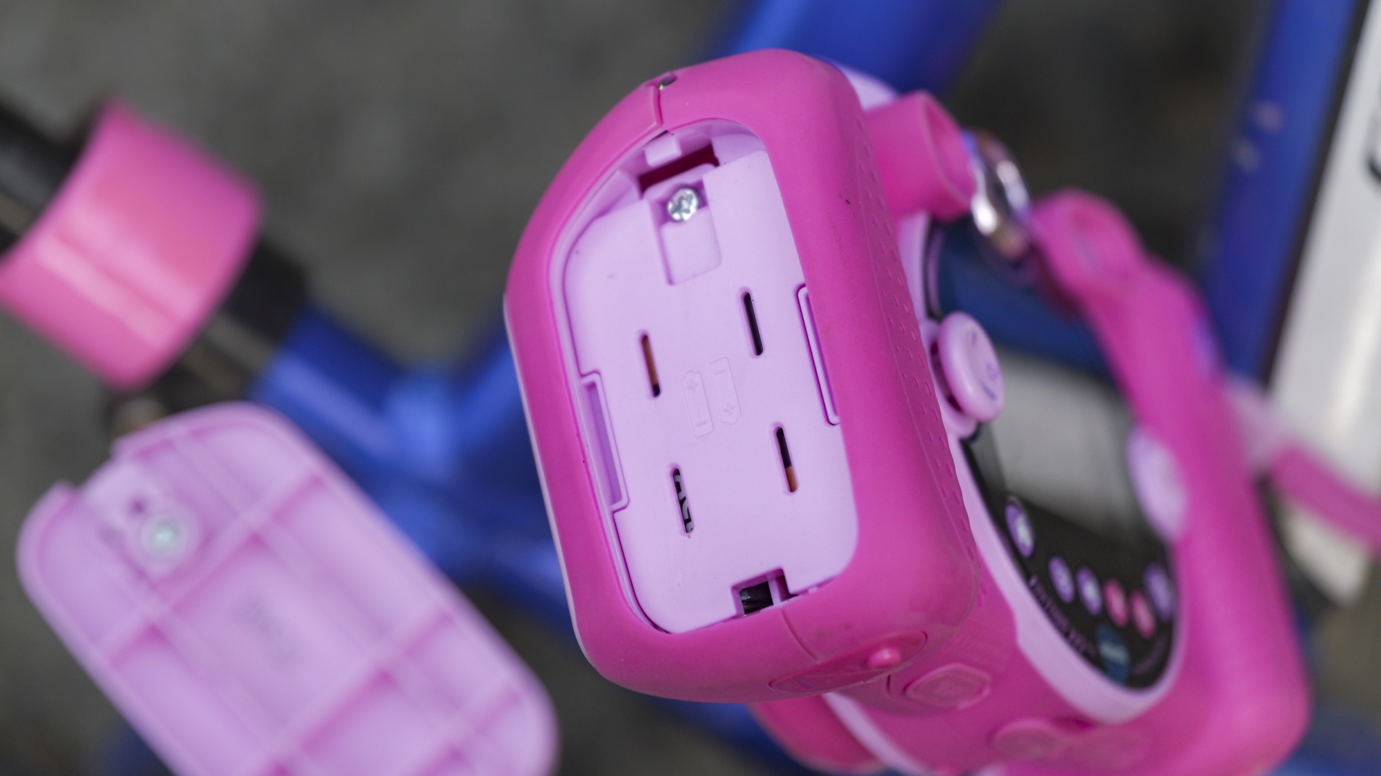 Battery compartment of a pink V-Tech KidiZoom Duo camera