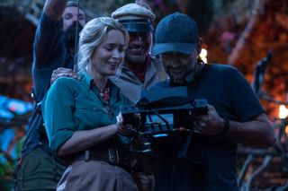 Jungle Cruise: stars Emily Blunt and Dwayne Johnson review the monitors on set with director Jaume Collet-Serra