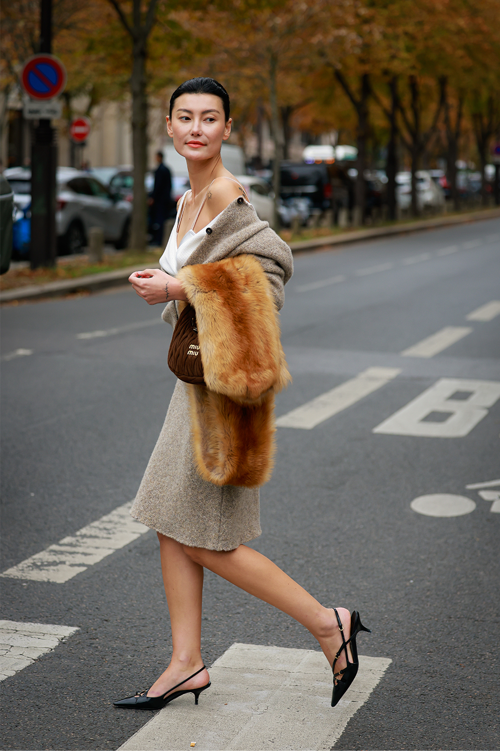Woman wearing a cardigan outfit.