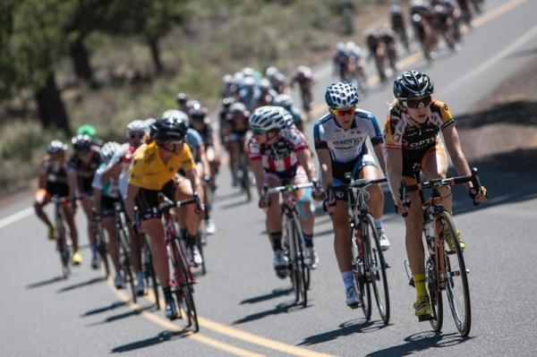 The GC leaders have a conversation near the front of the pack.