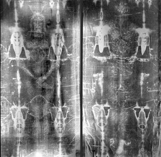 Full-length negative photograph of the Shroud of Turin.