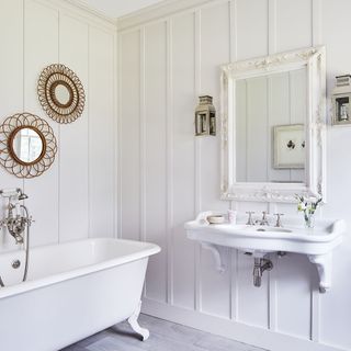 guest bathroom with white panelled walls