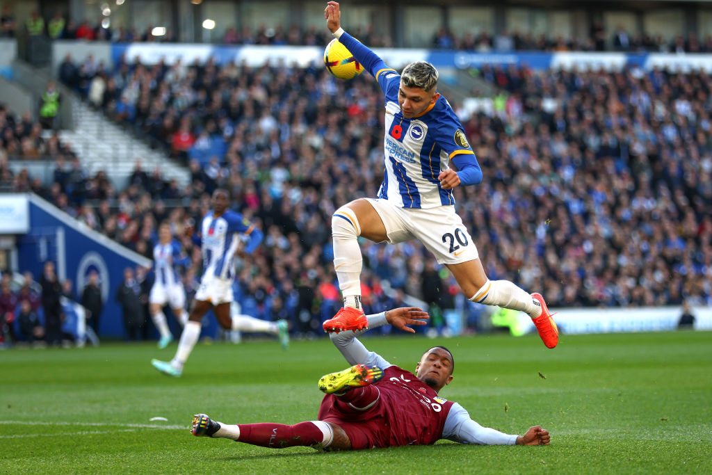 Julio Enciso of Brighton & Hove Albion is challenged by Ezri Konsa of Aston Villa during the Premier League match between Brighton & Hove Albion and Aston Villa at American Express Community Stadium on November 13, 2022 in Brighton, England.