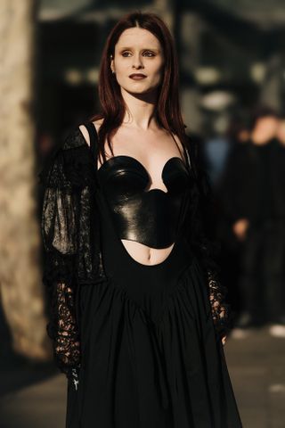 woman in a black bustier with pale skin