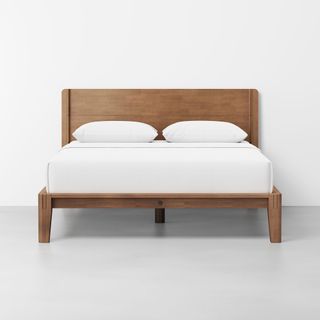 Thuma bed frame against a white wall.