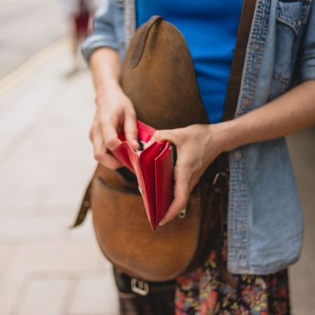 Young woman with purse in the street