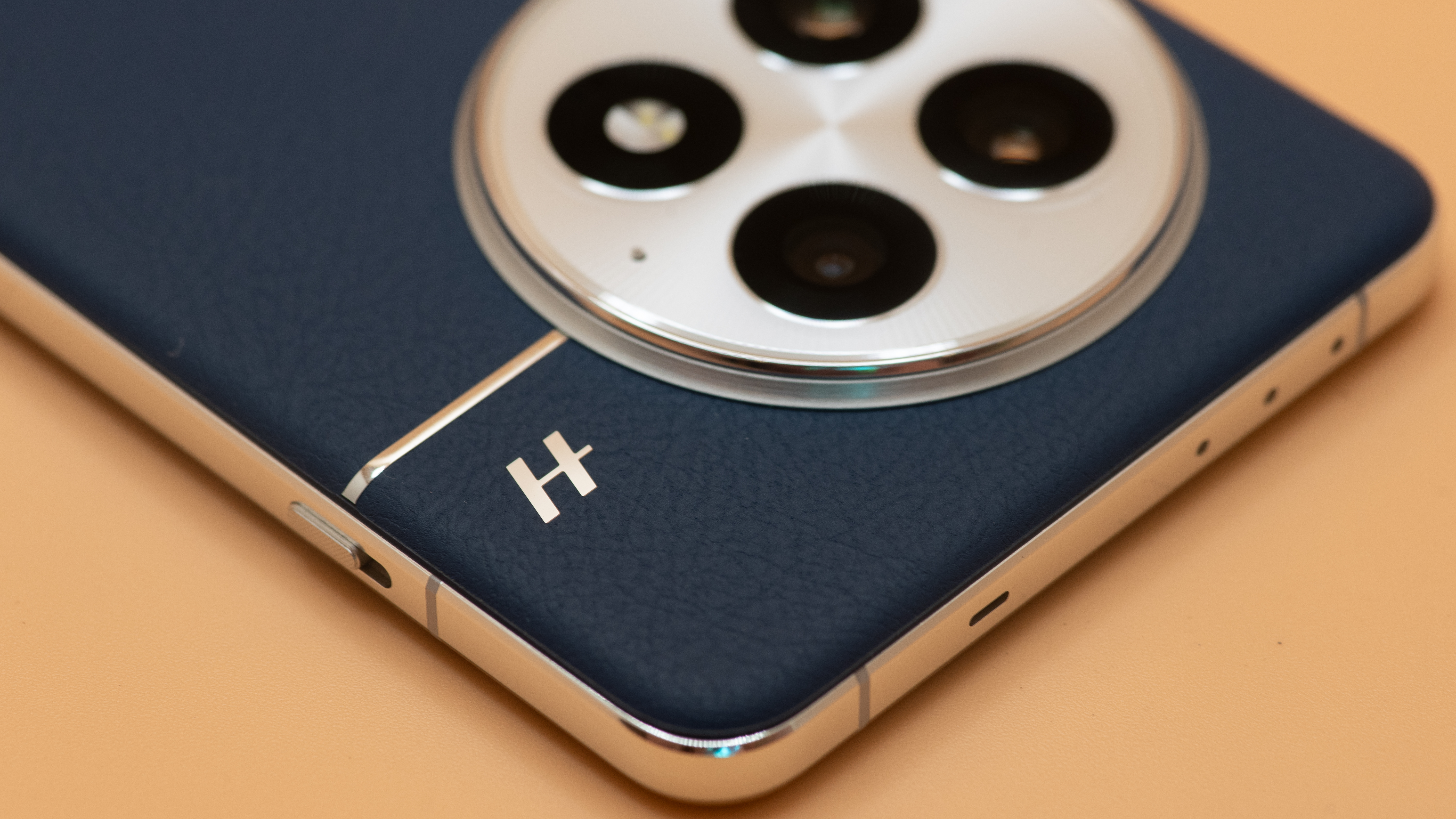 OnePlus 13 up close shot of textured back in blue microfiber vegan leather