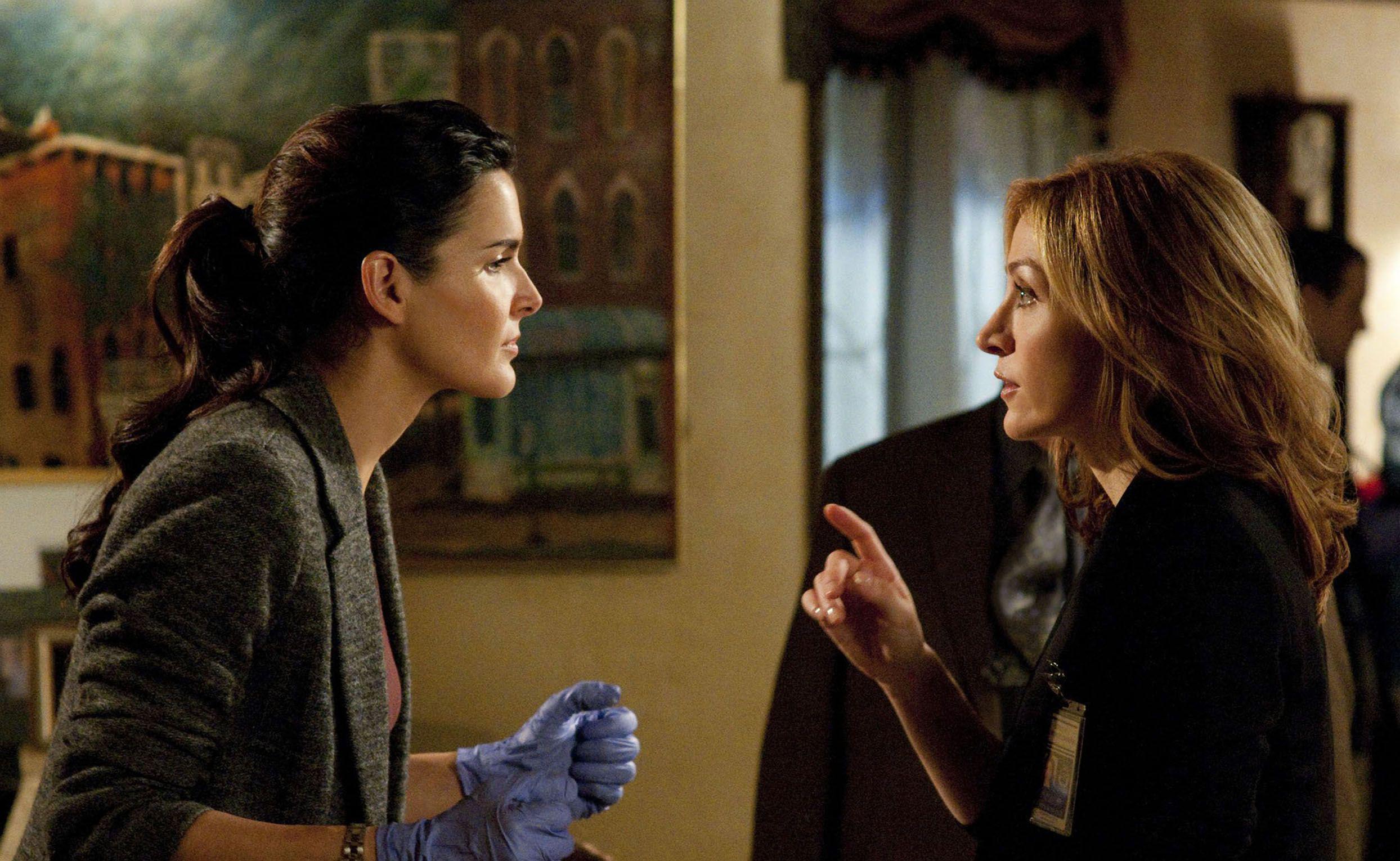 Angie Harmon and sasha alexander have a conversation while working on a crime scene in &#039;Rizzoli &amp;amp; Isles&#039;