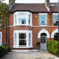 exterior with brick wall and white window