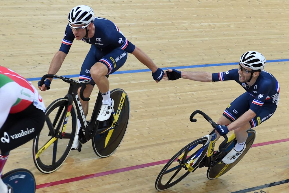 France's Morgan Kneisky (L) and Benjamin Thomas compete during the men's madison final at the Hong Kong Velodrome during the Track Cycling World Championships