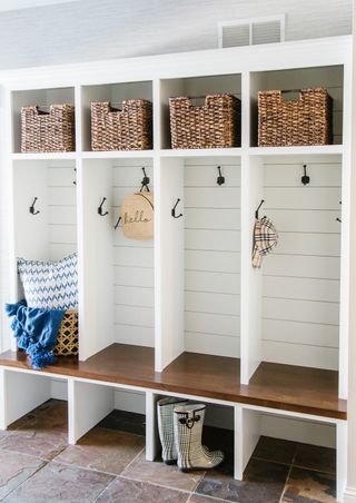 An entryway mud room with baskets