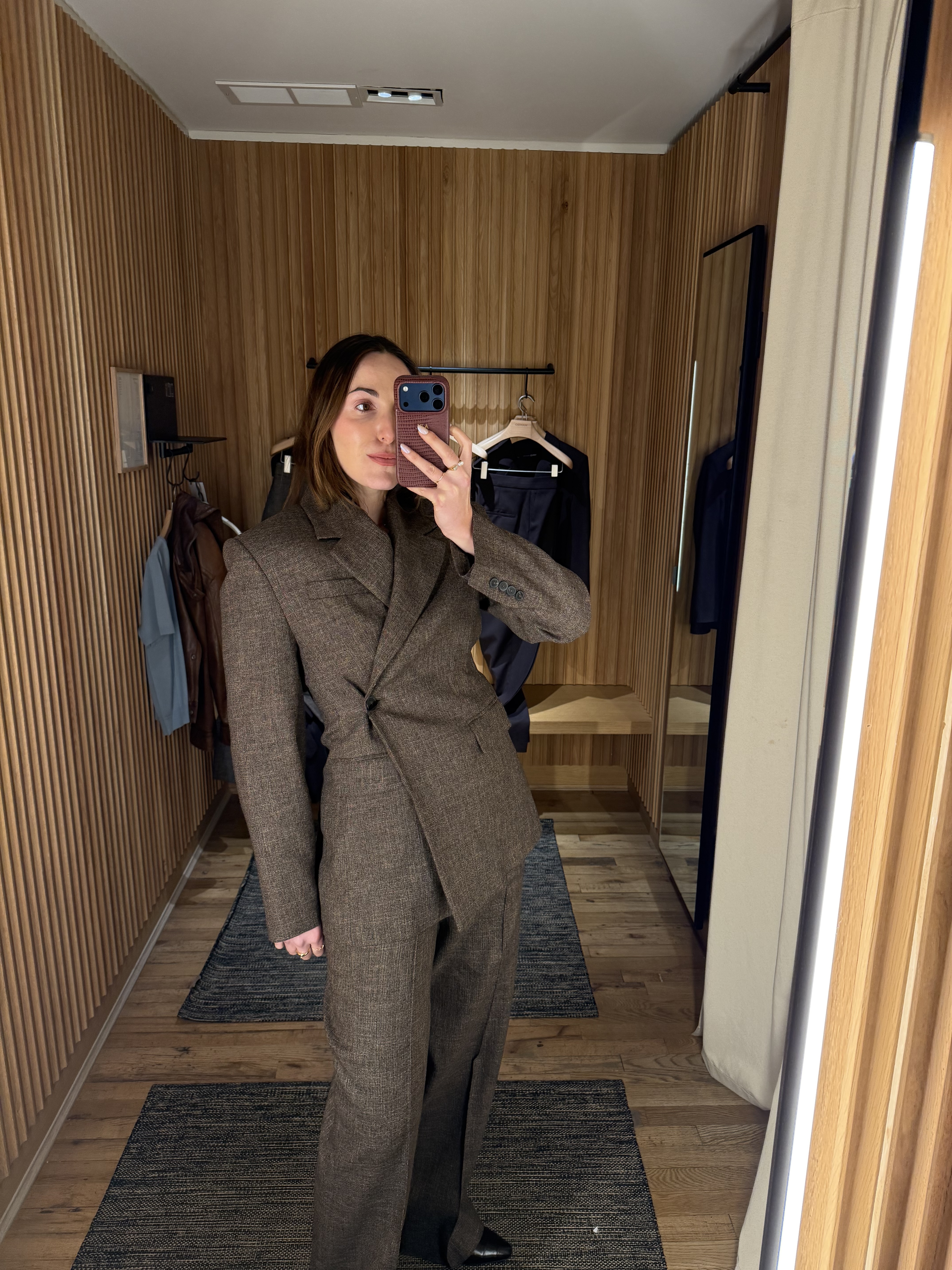 senior fashion editor Anna LaPlaca wearing Mango Selection pieces inside a store dressing room