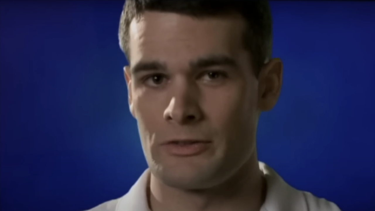 Man speaking in front of blue background on 30 Rock