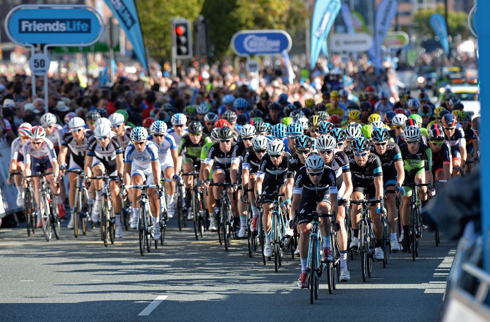 Riders pass the finish line with a lap to go, on the streets of Liverpool during the 104.8 km first stage of the Tour of Britain.