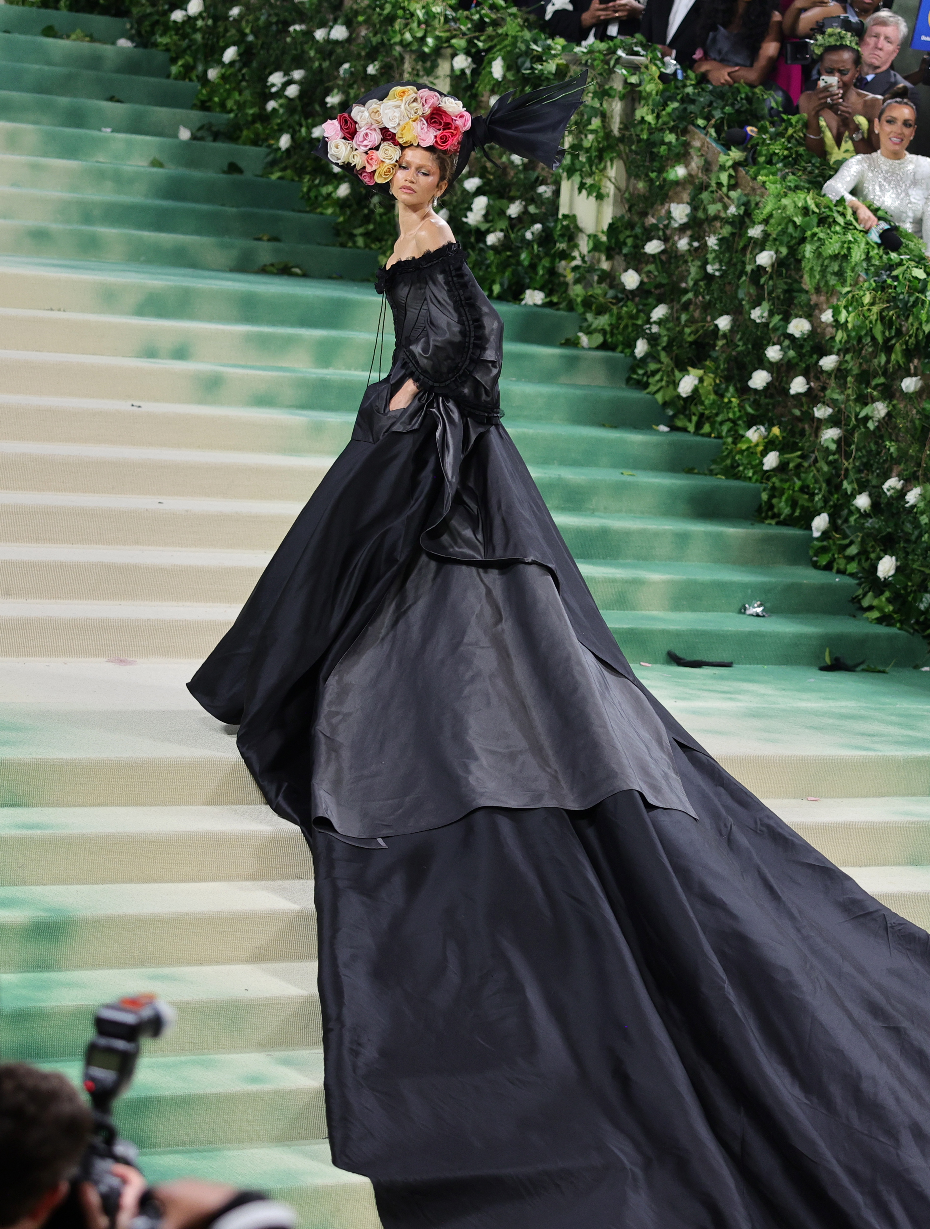 Zendaya wears a black gown with a long train at the 2024 Met Gala