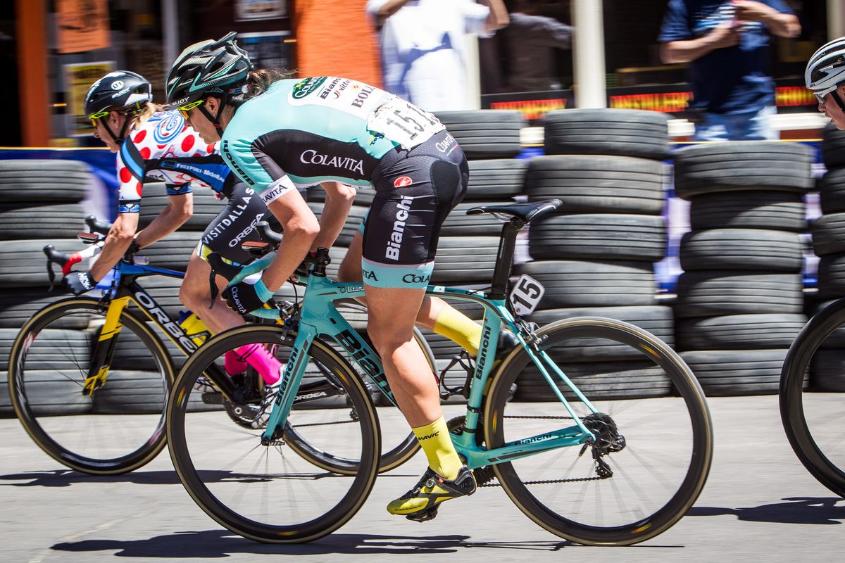 Riders jump hard out of the final turn during stage 4 at Tour of the Gila