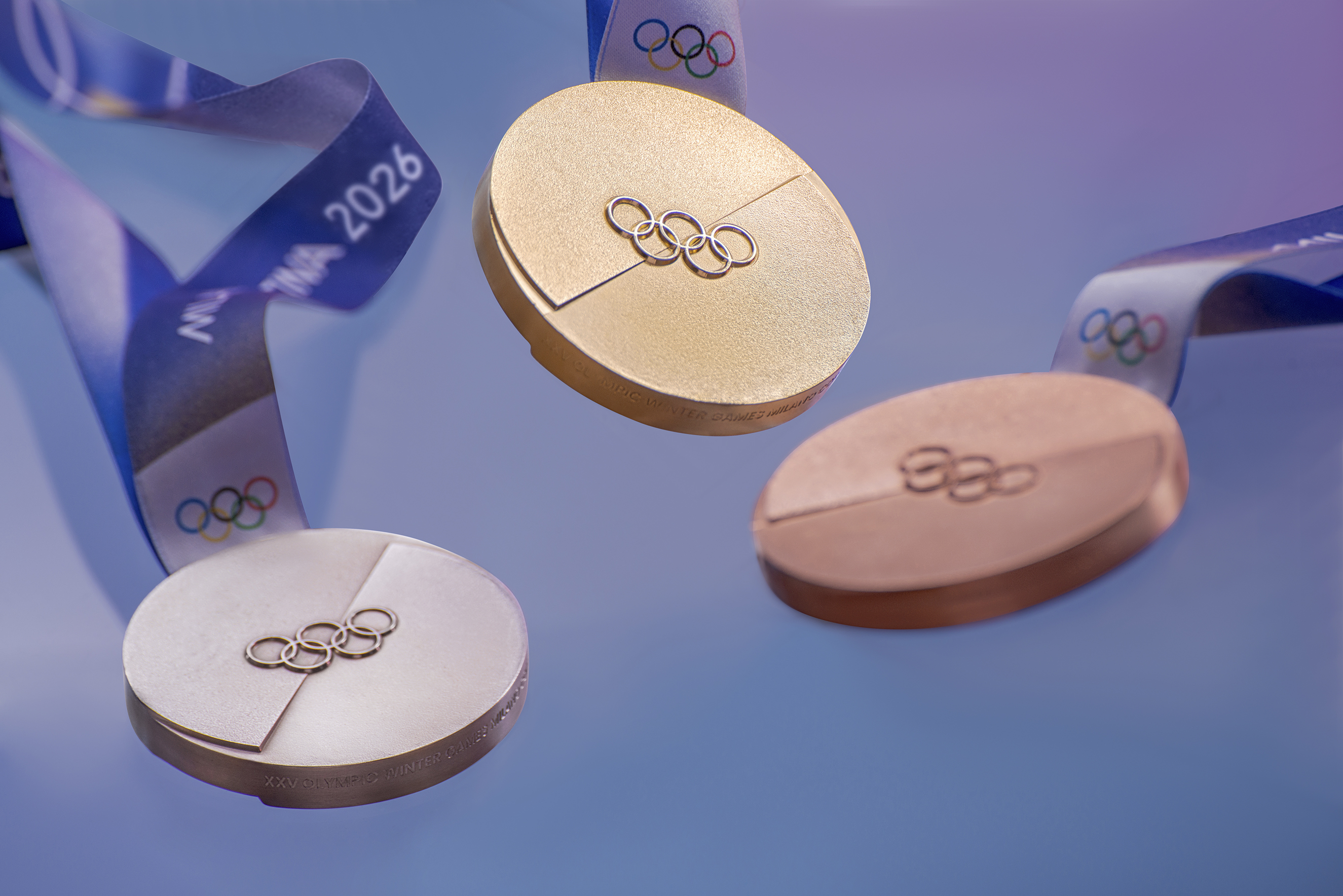 Medals for Winter Olympics 2026: gold, silver and bronze, with blue ribbon