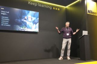 Photo of Comedy Wildlife Awards founder Paul Joynson-Hicks, on the Nikon stage at The Photography & Video Show 2024, announcing the competition partnering with photography brand Nikon