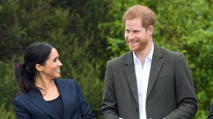 Prince Harry, Duke of Sussex and Meghan, Duchess of Sussex look at each other during a visit to the North Shore to dedicate a 20-hectare area of native bush to The Queen's Commonwealth Canopy on October 30, 2018