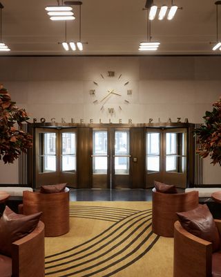 50 Rockefeller Plaza lobby with art deco clock above revolving doors