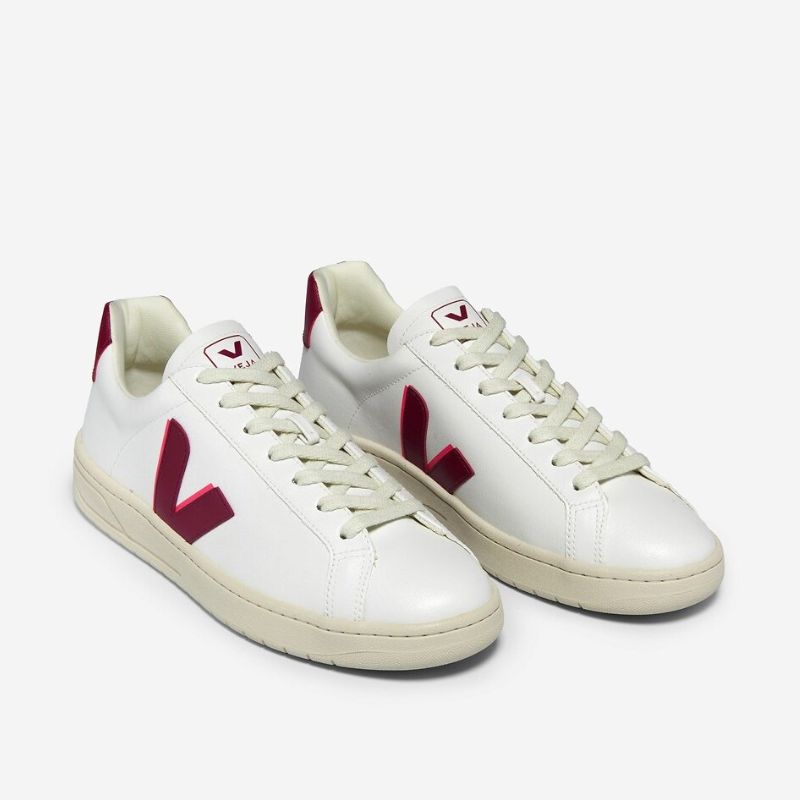 white trainers with red V emblem