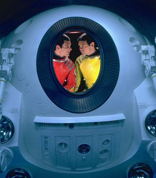 A publicity photo from "2001: A Space Odyssey" shows lead actor Keir Dullea as astronaut Dave Bowman (at left) conferring with co-star Gary Lockwood (Frank Poole) inside an EVA pod.
