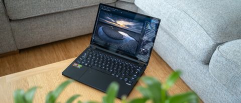 Asus ProArt PX13 laptop on a wooden surface