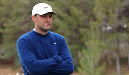 Scottie Scheffler stares on whilst standing on the first tee