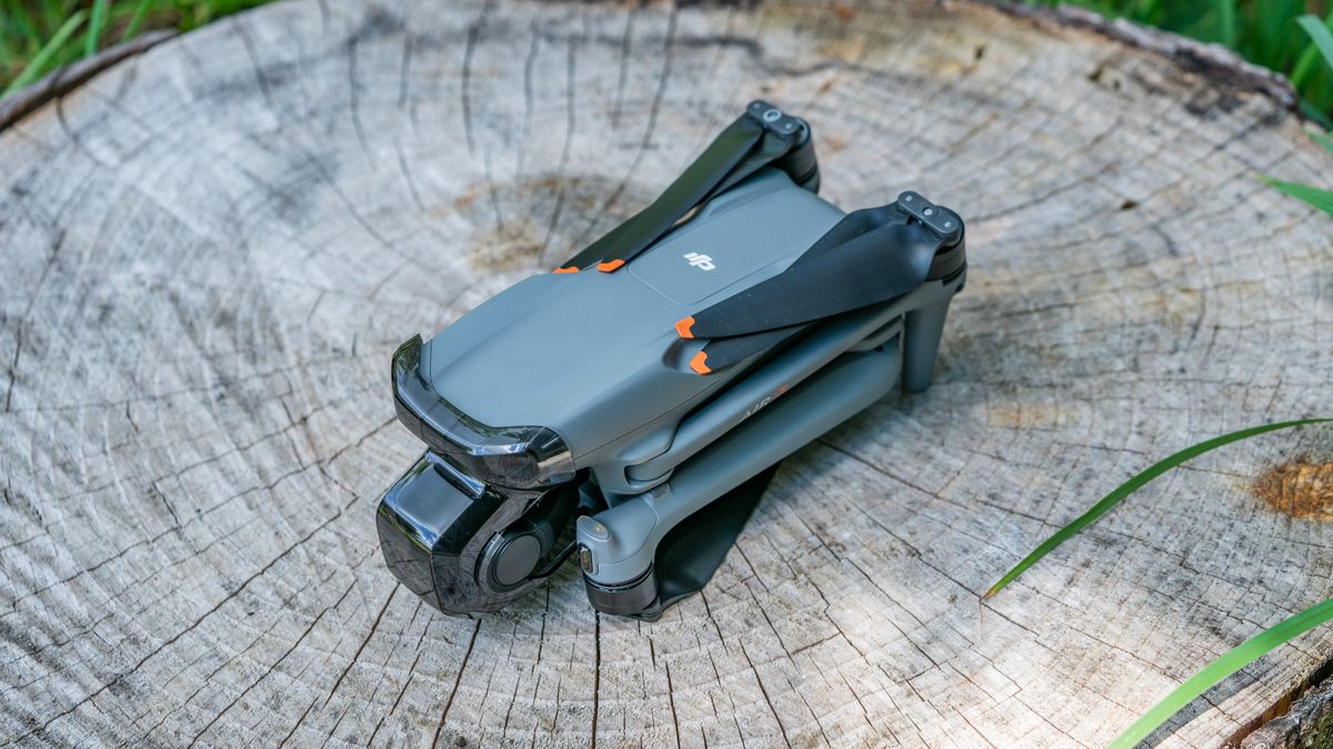 DJI Air 3 drone on a tree stump with arms and propellors folded away