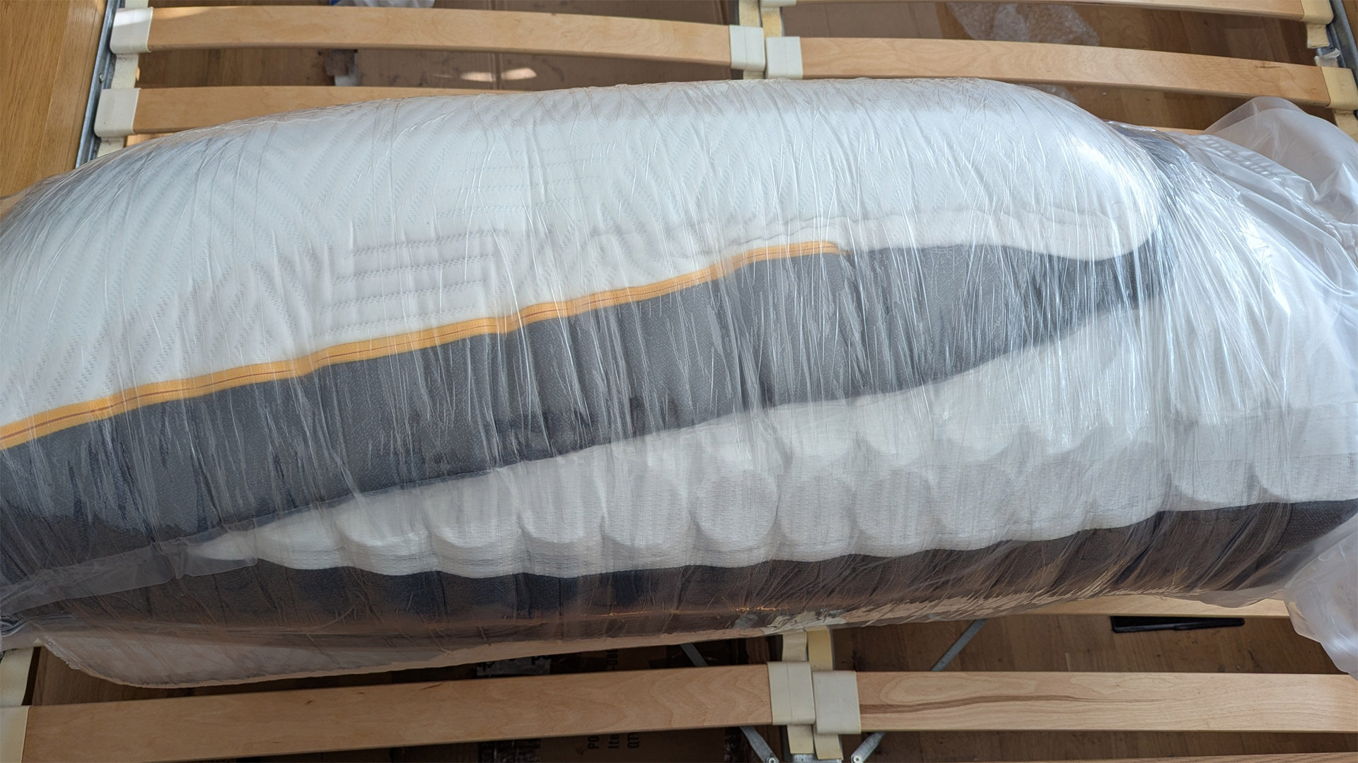 A rolled up Emma Hybrid Airgrid mattress