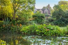 The mood changes in the lower garden, but views retain links with the house. Credit: Clive Nichols