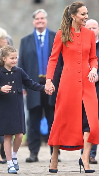 Kate Middleton's red coat: Catherine, Duchess of Cambridge and Princess Charlotte of Cambridge depart after a visit of Cardiff Castle on June 04, 2022 in Cardiff, Wales.