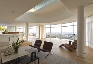 open plan white living space at Oceanus House by Pierre de Angelis