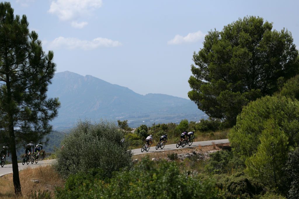 BALCON DE ALICANTE SPAIN AUGUST 20 A general view of Stan Dewulf of Belgium and AG2R Citren Team James Knox of United Kingdom and Team Deceuninck QuickStep Pelayo Sanchez Mayo of Spain and Team Burgos BH and Nicholas Schultz of Australia and Team BikeExchange compete in the chase group during the 76th Tour of Spain 2021 Stage 7 a 152km stage from Ganda to Balcn de Alicante lavuelta LaVuelta21 on August 20 2021 in Balcn de Alicante Spain Photo by Gonzalo Arroyo MorenoGetty Images