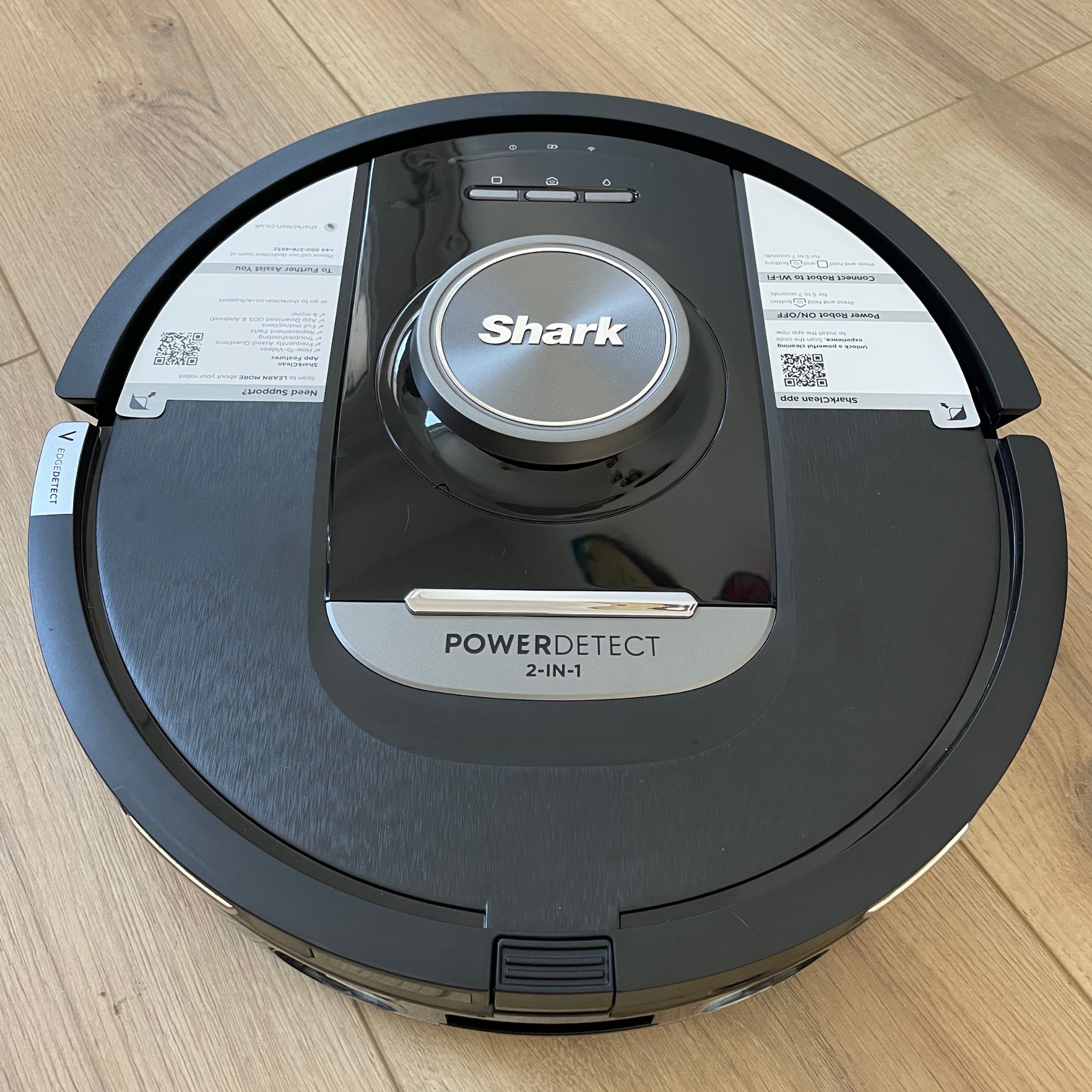 Shark PowerDetect NeverTouch Robot Vacuum and Mop on wooden floor