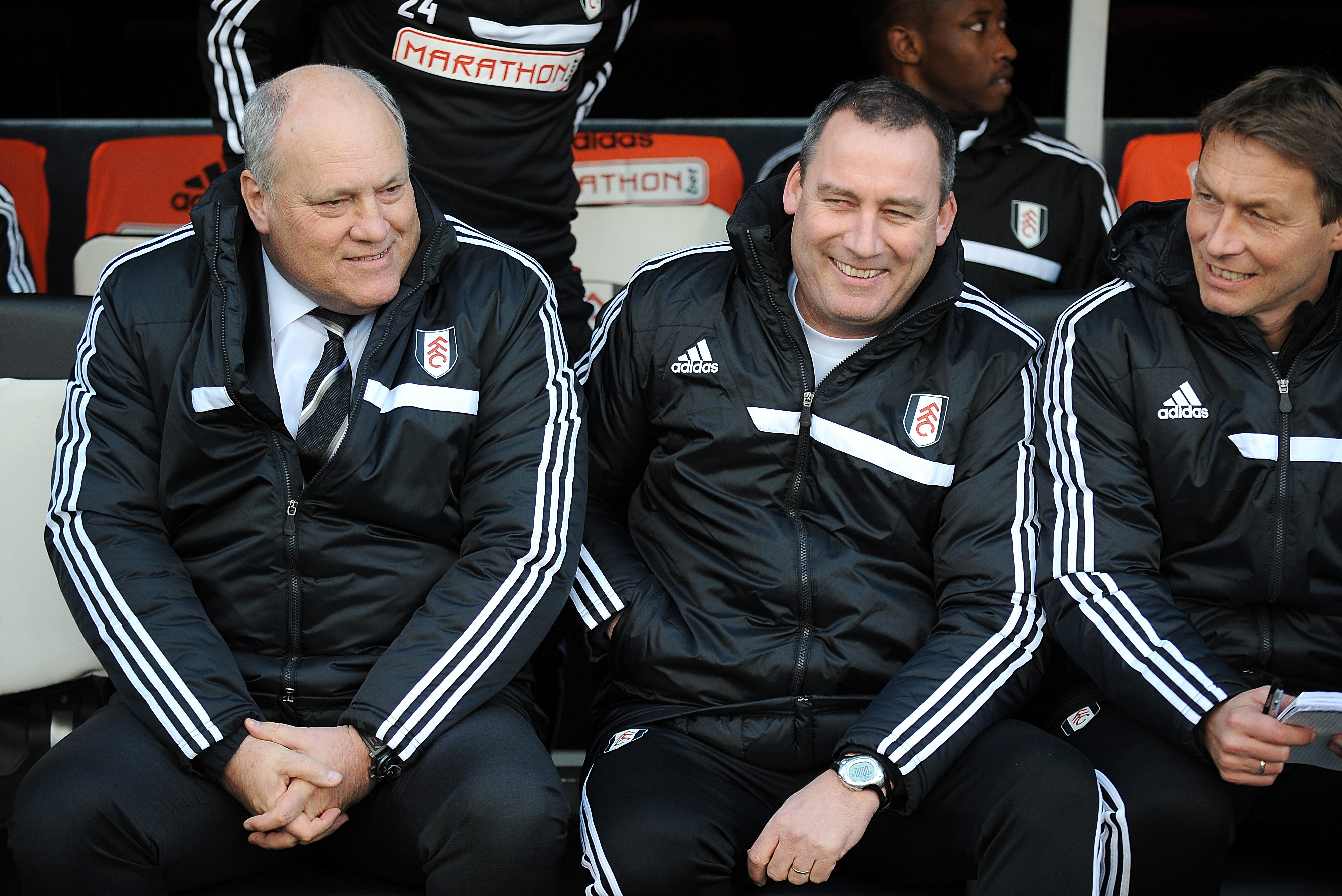 Rene Meulensteen, centre, and Martin Jol, left, in the Fulham dugout