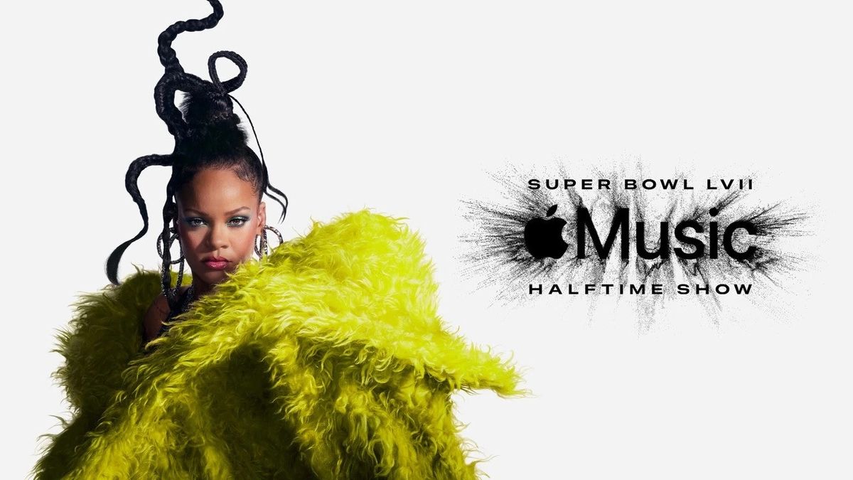 Rihanna in green dress promoting Apple Music Super Bowl Halftime Show