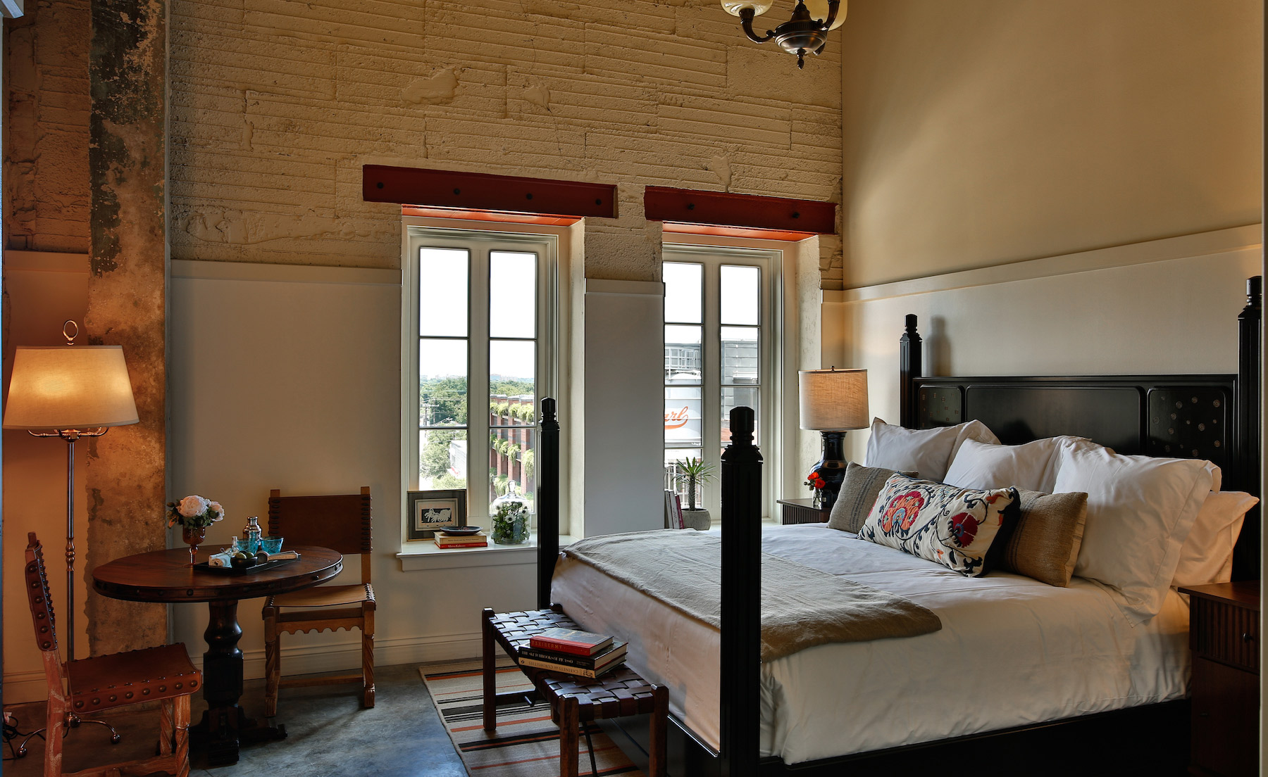 Rooms in the brewhouse tower feature chipped plaster walls kept fresh with hand-crafted white oak and caramel leather sofas
