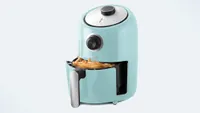 Dash Compact Air Fryer in aqua blue color with tray showing fries inside