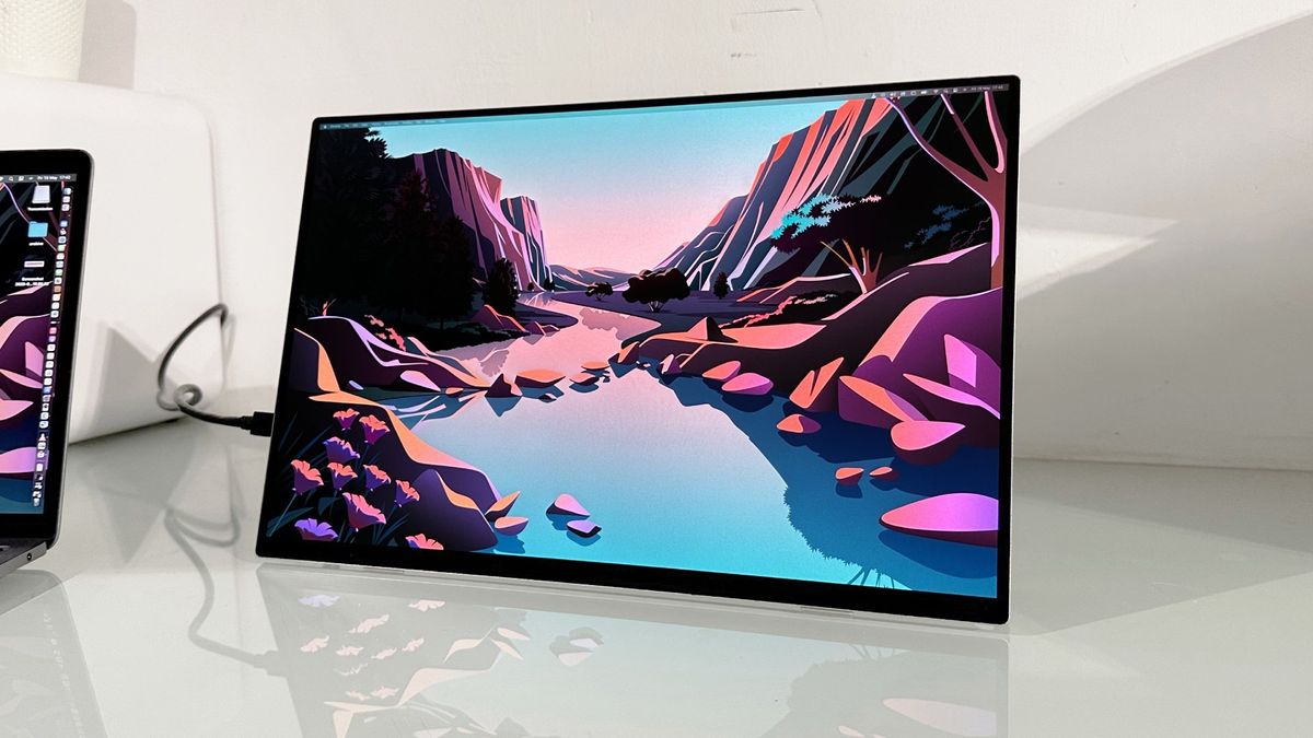 Testing the Acer ProDesigner PE160WUT in a home office next to a MacBook