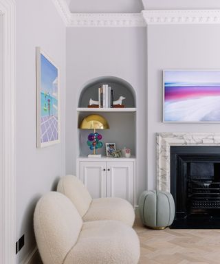 pastel living room ideas, lavender living room with alcove shelving, boucle chairs, artwork