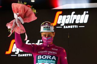 Team BoraHansgrohe rider Slovakias Peter Sagan celebrates his best sprinters Cyclamen jersey on the podium after the twelfth stage of the Giro dItalia 2021 cycling race 212 km between Siena and Bagno di Romagna on May 20 2021 Photo by Luca Bettini AFP Photo by LUCA BETTINIAFP via Getty Images