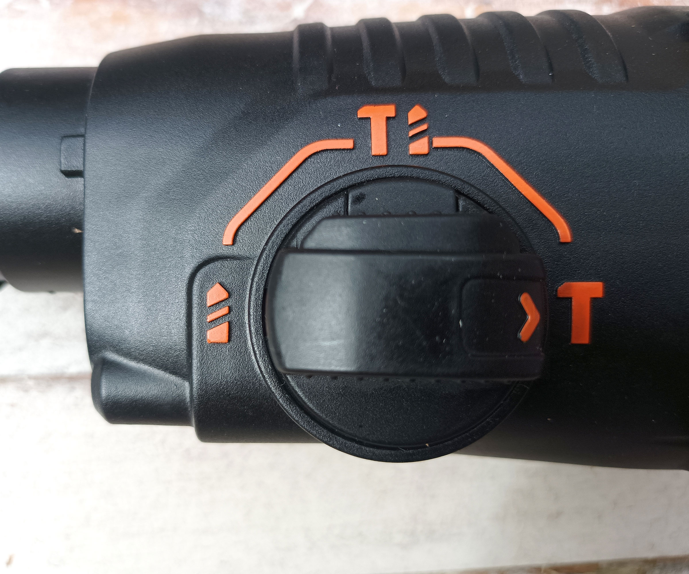 Close-up of the mode selector button on Black and Decker SDS Hammer Drill