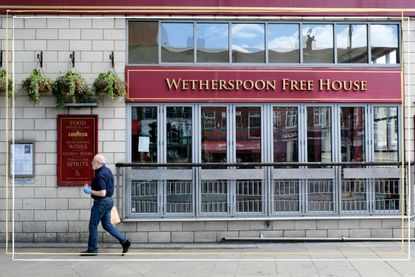 a close up of a Wetherspoons pub closed with a yellow border