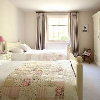 bedroom with simple bed and statement curtains